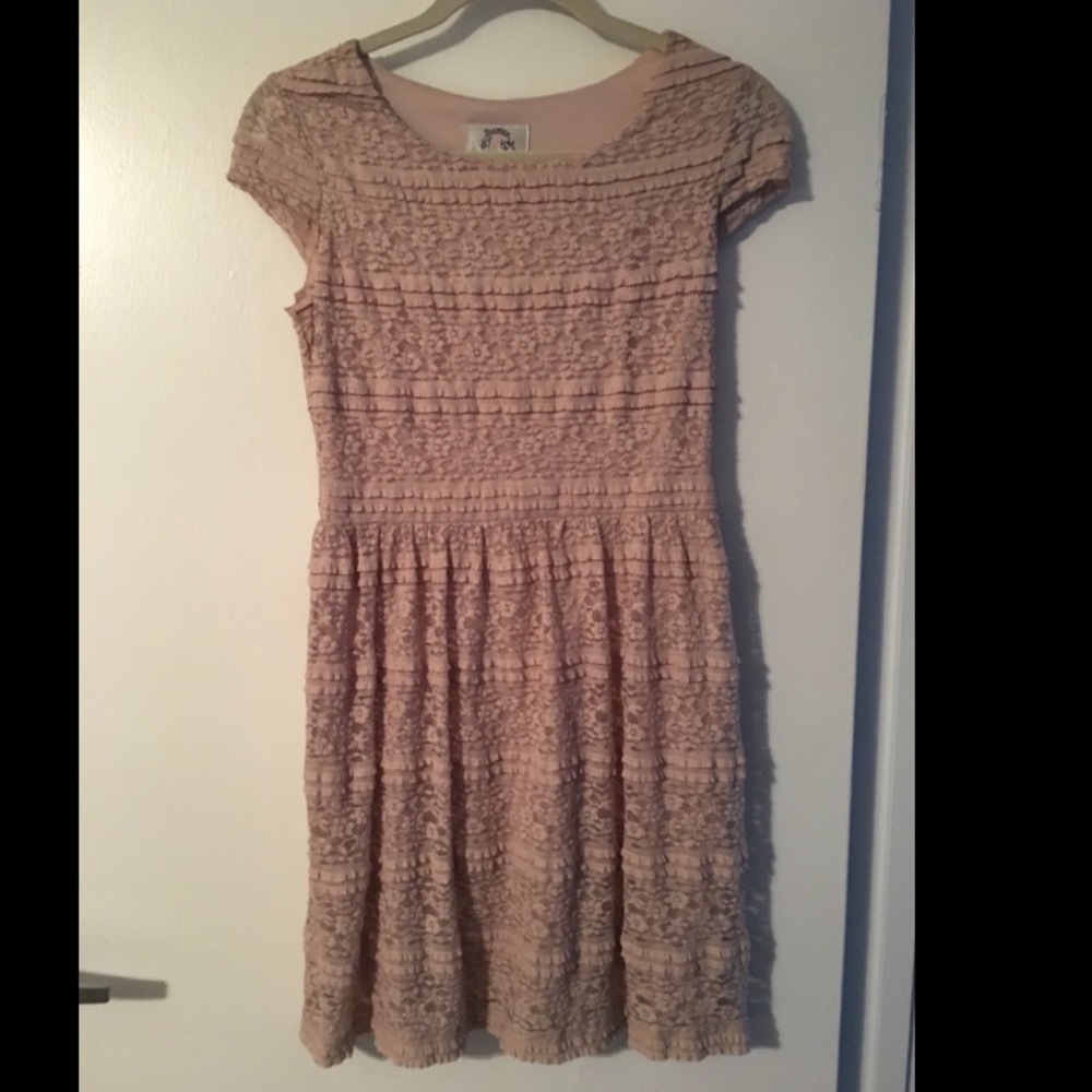 Tan a-line fit and flare dress.